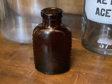 Load image into Gallery viewer, Antique poison bottle - amber glass
